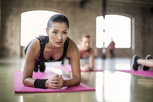 Free Women Doing a Yoga on Yoga Mat Stock Photo